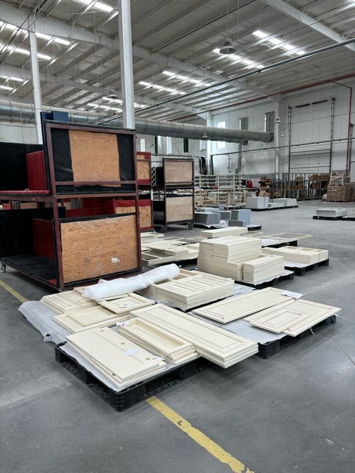 Finished cabinet doors palletised on the Cabo factory floor