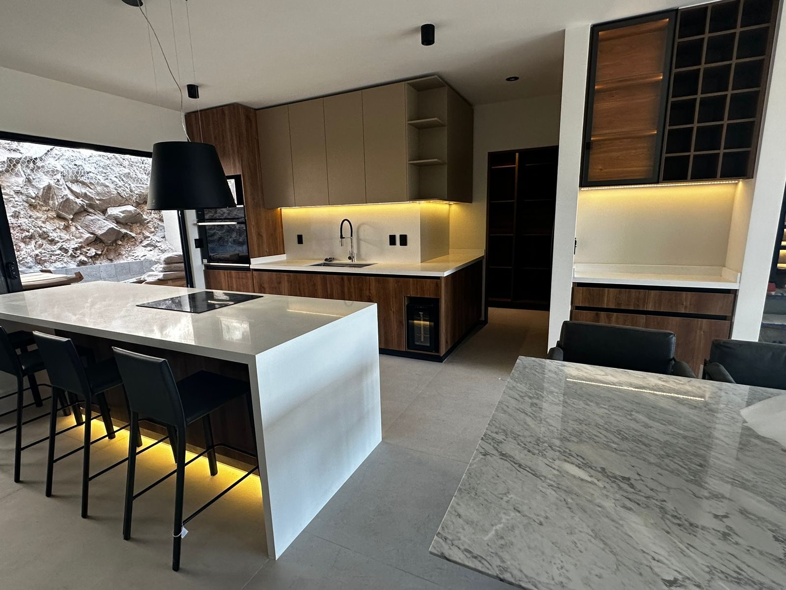 A contemporary wood and stone kitchen built by Cabo